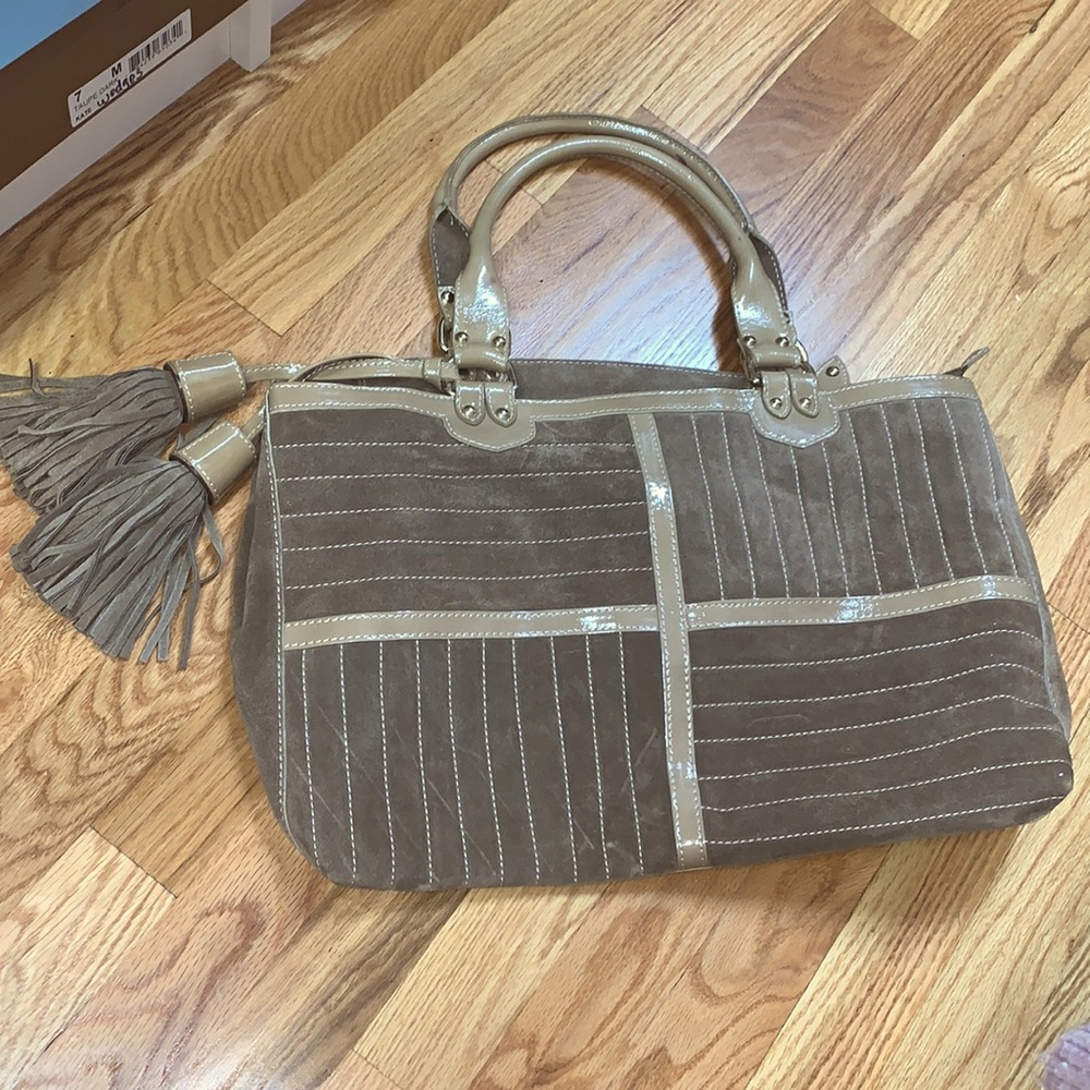 Chic Tan Tote with Tassel Accents